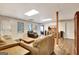 Spacious basement living area features hardwood floors and comfortable furnishings at 102 Passage Point, Peachtree City, GA 30269