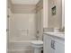 Clean and modern bathroom with a shower-tub combination and elegant white vanity at 102 Passage Point, Peachtree City, GA 30269