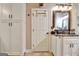 View of the bathroom with white cabinets, granite counters and door to water closet at 102 Passage Point, Peachtree City, GA 30269