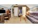 Comfortable bonus room features a dark futon and decorative accents for a relaxing atmosphere at 102 Passage Point, Peachtree City, GA 30269