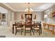 Formal dining room with a chandelier, wainscoting, and a traditional table and chairs at 102 Passage Point, Peachtree City, GA 30269