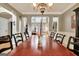 Dining room featuring an elegant chandelier and a long wooden table with seating for many at 102 Passage Point, Peachtree City, GA 30269