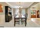 Traditional dining room with a chandelier, dark wood table, and wainscoting detail at 102 Passage Point, Peachtree City, GA 30269