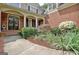 Charming entryway featuring a decorative front door, columns, and lush landscaping at 102 Passage Point, Peachtree City, GA 30269