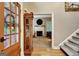Inviting foyer featuring hardwood floors, a staircase, and a glimpse into the living room with fireplace at 102 Passage Point, Peachtree City, GA 30269