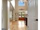 Spacious foyer with high ceilings, hardwood floors, and double doors with floral accents at 102 Passage Point, Peachtree City, GA 30269