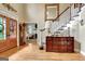 Welcoming foyer with hardwood floors, a staircase, and a glimpse into the living room at 102 Passage Point, Peachtree City, GA 30269