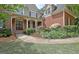 Charming brick home with a welcoming front entrance and beautifully landscaped yard at 102 Passage Point, Peachtree City, GA 30269