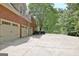Three car garage is situated on the side of the house at 102 Passage Point, Peachtree City, GA 30269
