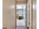 Open hallway leading to a brightly lit room, offering seamless transition between spaces at 102 Passage Point, Peachtree City, GA 30269