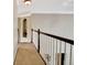 Hallway with tan carpet and view into a decorative niche at 102 Passage Point, Peachtree City, GA 30269