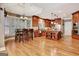 Spacious kitchen with hardwood floors, wood cabinets, stainless steel appliances, and a center island at 102 Passage Point, Peachtree City, GA 30269