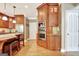 Bright kitchen features hardwood floors, stainless steel appliances, and custom wood cabinets at 102 Passage Point, Peachtree City, GA 30269