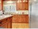 Well-appointed kitchen features custom cabinetry, granite countertops, and modern appliances at 102 Passage Point, Peachtree City, GA 30269