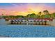 Scenic sunset view of Lake Peachtree bridge with stone embankment and a water feature at 102 Passage Point, Peachtree City, GA 30269