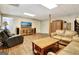 Finished basement with hardwood floors, entertainment area, and cozy seating arrangement at 102 Passage Point, Peachtree City, GA 30269