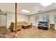Spacious living room featuring hardwood floors and natural light from windows and door at 102 Passage Point, Peachtree City, GA 30269
