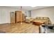Spacious living room area featuring hardwood floors, shelving units and comfortable couches at 102 Passage Point, Peachtree City, GA 30269