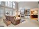 Spacious living room boasts fireplace, built-in shelves, and large windows for ample natural light at 102 Passage Point, Peachtree City, GA 30269