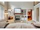 Open concept living room with fireplace, built-ins, and an attached kitchen at 102 Passage Point, Peachtree City, GA 30269