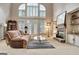 Bright living room with fireplace, neutral carpet, and large windows at 102 Passage Point, Peachtree City, GA 30269