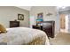 Comfortable bedroom featuring neutral tones and a well-lit area for relaxing evenings at 102 Passage Point, Peachtree City, GA 30269