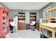 Organized office space featuring built-in bookshelves and filing cabinets providing both storage and functional space at 102 Passage Point, Peachtree City, GA 30269