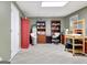 Functional office space with shelves, cabinets and seating, providing both storage and a workspace at 102 Passage Point, Peachtree City, GA 30269