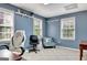 Bright office features natural light, shelves, and comfortable seating options for a productive workspace at 102 Passage Point, Peachtree City, GA 30269