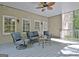 Covered porch with ample seating and a ceiling fan, an inviting space for outdoor relaxation and entertaining at 102 Passage Point, Peachtree City, GA 30269
