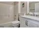 Bathroom with white vanity with marble countertop, toilet, and shower/tub combo at 102 Passage Pt, Peachtree City, GA 30269