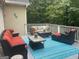 Spacious deck featuring comfortable seating arrangements, offering a relaxing outdoor living space at 102 Passage Pt, Peachtree City, GA 30269