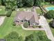 Beautiful aerial view of brick home with landscaped yard, pool, and driveway at 186 Ashley Dr, Mcdonough, GA 30252