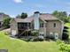 Lush backyard showcasing brick house, an outdoor deck, and a well-manicured lawn at 186 Ashley Dr, Mcdonough, GA 30252