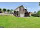 Well-maintained backyard with brick house, deck access, and a sloping lawn at 186 Ashley Dr, Mcdonough, GA 30252