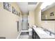Bathroom features shower, decorative art, vanity, and tile flooring at 186 Ashley Dr, Mcdonough, GA 30252