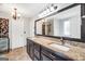 Bathroom features double sinks, granite countertops, tile floors and a large mirror at 186 Ashley Dr, Mcdonough, GA 30252