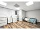 This bedroom features laminate wood flooring, neutral walls, and bright, recessed lighting at 186 Ashley Dr, Mcdonough, GA 30252