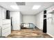 Bedroom with neutral walls, shelving, and laminate flooring bathed in recessed lighting at 186 Ashley Dr, Mcdonough, GA 30252