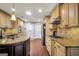 Spacious kitchen features stainless steel appliances, granite countertops, an island and wood floors at 186 Ashley Dr, Mcdonough, GA 30252