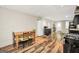 Open kitchen features a dining area, modern appliances, and durable laminate floors at 186 Ashley Dr, Mcdonough, GA 30252