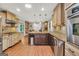 Gourmet kitchen with stainless steel appliances, granite countertops, and a breakfast bar at 186 Ashley Dr, Mcdonough, GA 30252