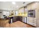 Spacious kitchen with modern appliances, a breakfast bar, and an open layout at 186 Ashley Dr, Mcdonough, GA 30252