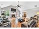 Spacious living room featuring a brick fireplace, vaulted ceilings, and hardwood flooring at 186 Ashley Dr, Mcdonough, GA 30252