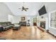 Open living room with a fireplace, large windows, and hardwood floors create a bright space at 186 Ashley Dr, Mcdonough, GA 30252