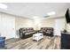 Spacious living room features two sofas, a coffee table and luxury vinyl plank flooring at 186 Ashley Dr, Mcdonough, GA 30252