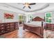 Main bedroom features hardwood floors, trey ceiling, ceiling fan, and natural light at 186 Ashley Dr, Mcdonough, GA 30252