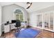 Bright office featuring a large arched window, hardwood floors, and modern furnishings at 186 Ashley Dr, Mcdonough, GA 30252