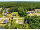 Aerial view showing a neighborhood with large lots and mature trees at 30 Hollyhock Ln, Covington, GA 30014