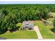 Aerial view of home showcasing well-manicured lawn and mature trees at 30 Hollyhock Ln, Covington, GA 30014